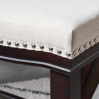 Tabouret de comptoir contemporain rembourré en forme de selle avec garniture cloutée