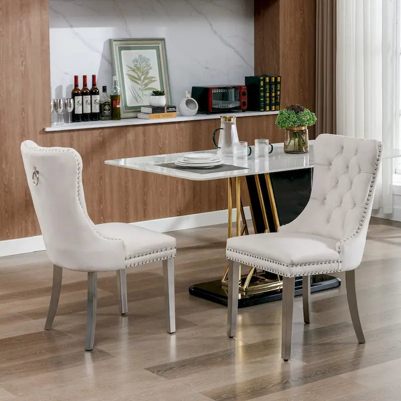 Chaise de salle à manger en velours avec clous décoratifs et pieds en acier inoxydable chromé