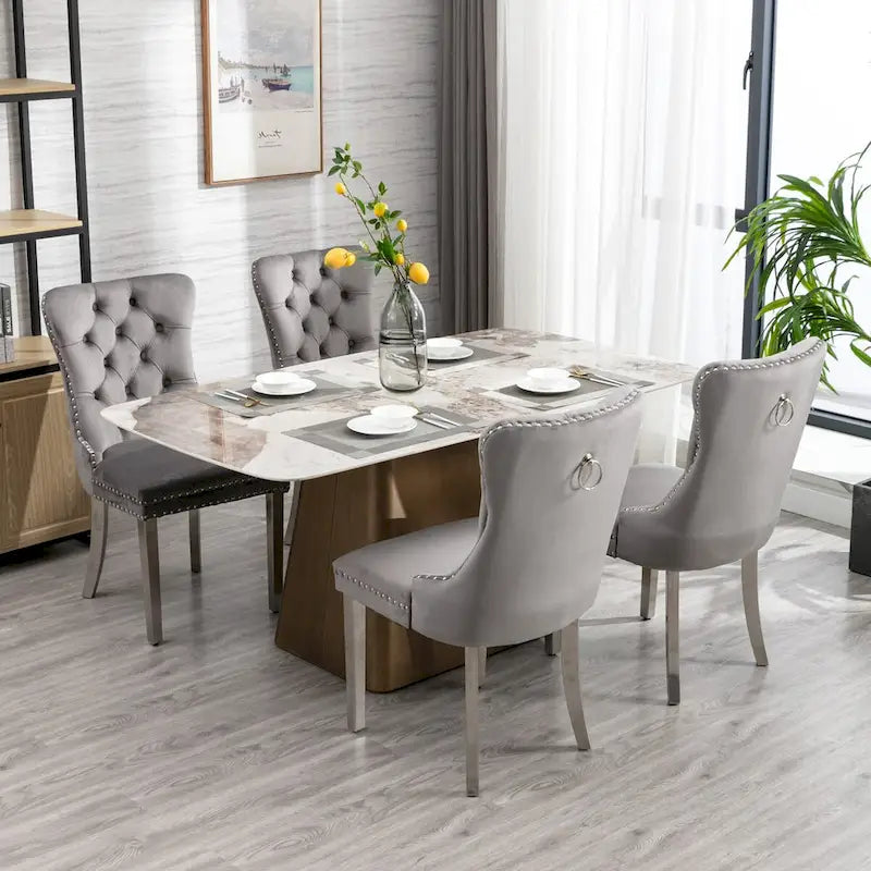Chaise de salle à manger en velours avec clous décoratifs et pieds en acier inoxydable chromé