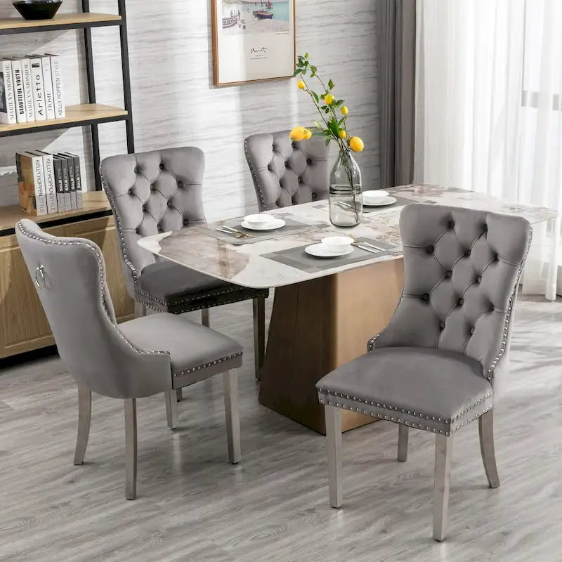Chaise de salle à manger en velours avec clous décoratifs et pieds en acier inoxydable chromé